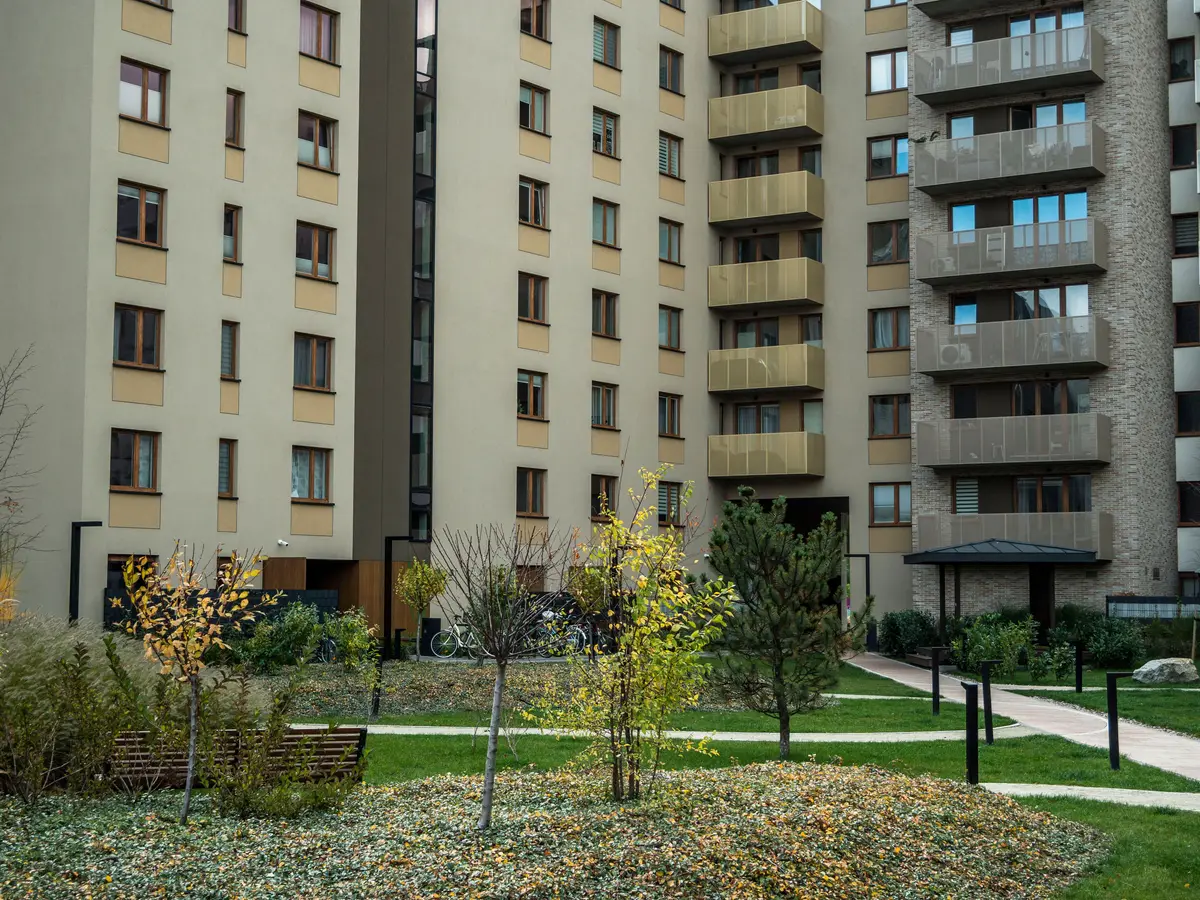 A landscaped courtyard and pathway between two managed apartment blocks