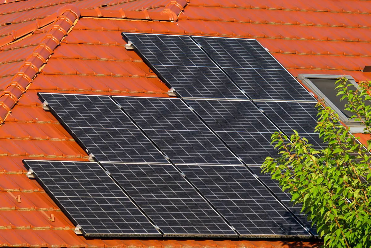 Close-up of solar panels mounted on a tiled roof