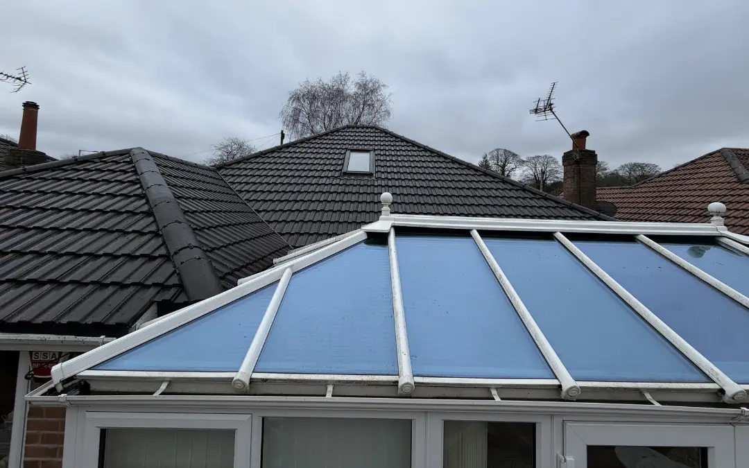 The same conservatory roof cleaned, bars white and glass clear