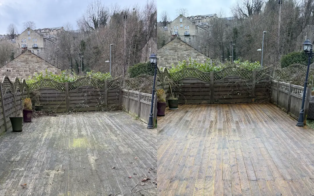 Timber decking green with algae and covered in leaf debris