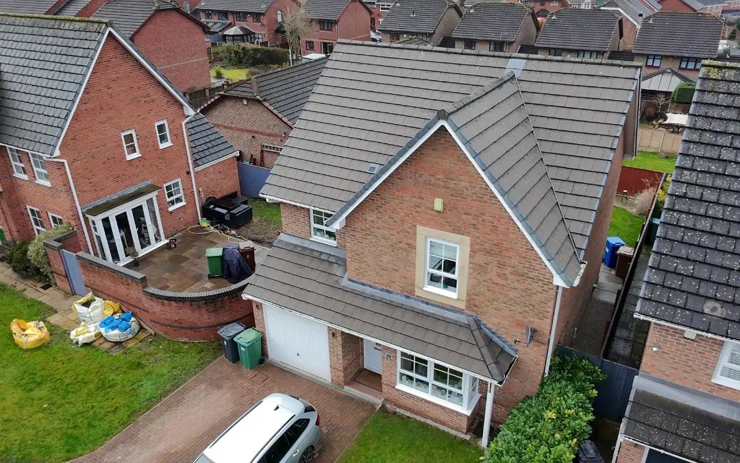 Aerial view of adjoining roofs covered in moss