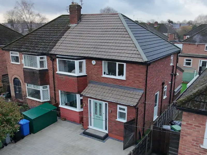 A pitched roof after moss removal