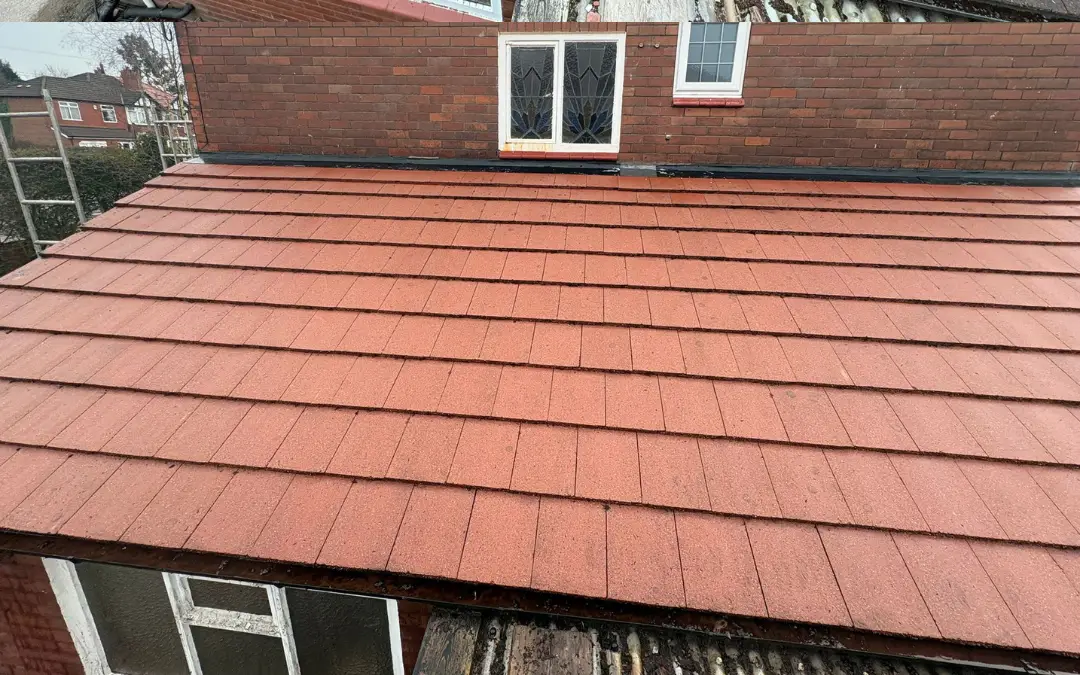 The same roof after cleaning, tile colour returned